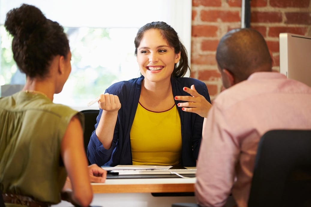 Couple Meeting with Financial Advisor in Office